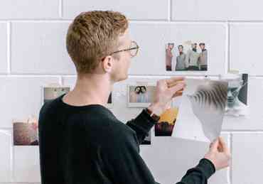 Man hanging pictures